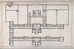 Schwarz-weißer Architekturplan eines Gebäudegeschosses mit zahlreichen beschrifteten Räumen, darunter ein als Irrenhaus für Kriminelle ausgewiesener Bereich, samt handschriftlichem Text.