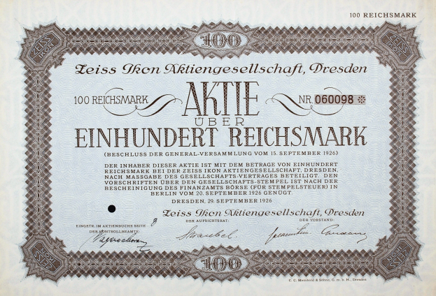 Deutsches Aktienzertifikat für 100 Reichsmark mit schwarzem Rand und gedrucktem Text.