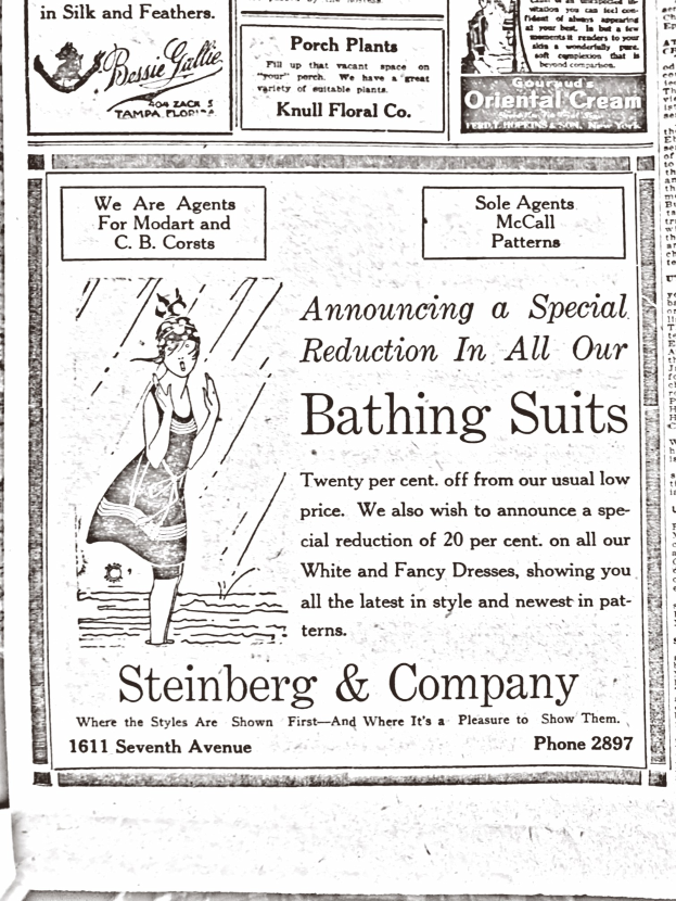 Eine Frau in einem weißen hochgeschlossenen Kleid mit langen Ärmeln und einem Dutt, umgeben von Text in einer Werbung für Steinberg & Company's Badesachen.