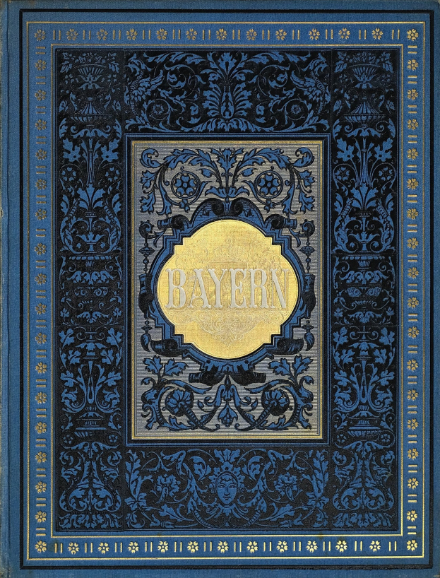 Ein blau-goldenes Buch mit dem Wort "Bayern" darauf, das mit detaillierten Verzierungen versehen ist.